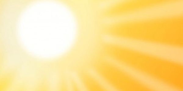 Strahlende Sonne auf gelbem Hintergrund