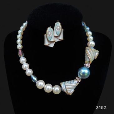 Elegant pearl necklace and matching earrings set.