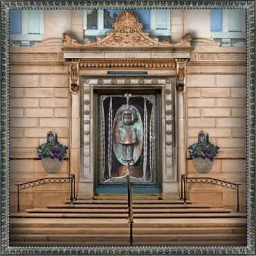 Ornate door with water fountain sculpture.