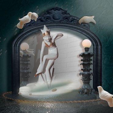 A surreal mirror with statue and floating fish.