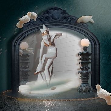 Elegant statue of a figure under water with fish.