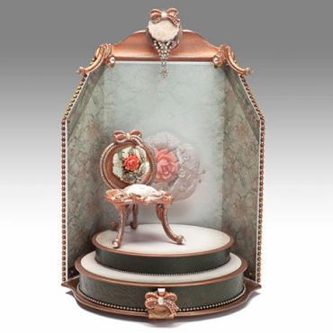 Ornate vintage display with floral decoration.