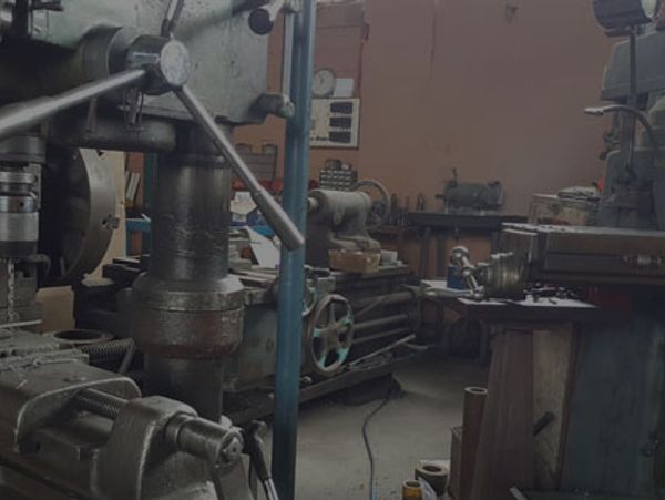 Industrial workshop with heavy machinery and tools.