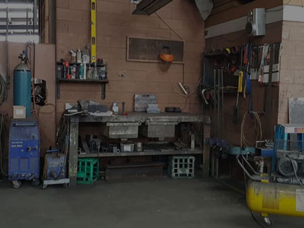 A workshop corner with tools and equipment.
