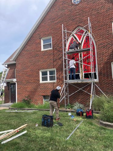 In process removing South windows for repair from the outside.