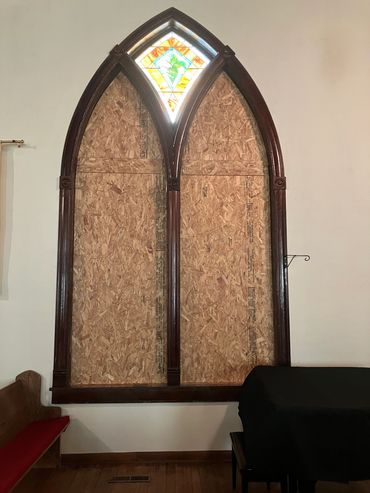 Inside view of West window openings boarded and sealed up. Top kite window was undamaged so it was l