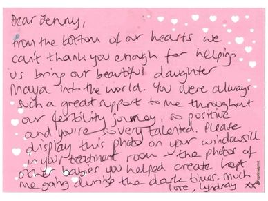 Handwritten thank-you note on pink heart-themed paper.