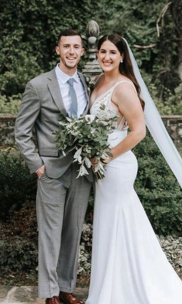 Happy couple posing on their wedding day.