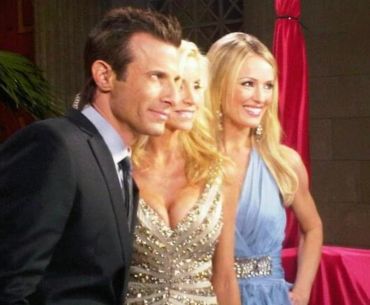 Three people posing at a formal event.