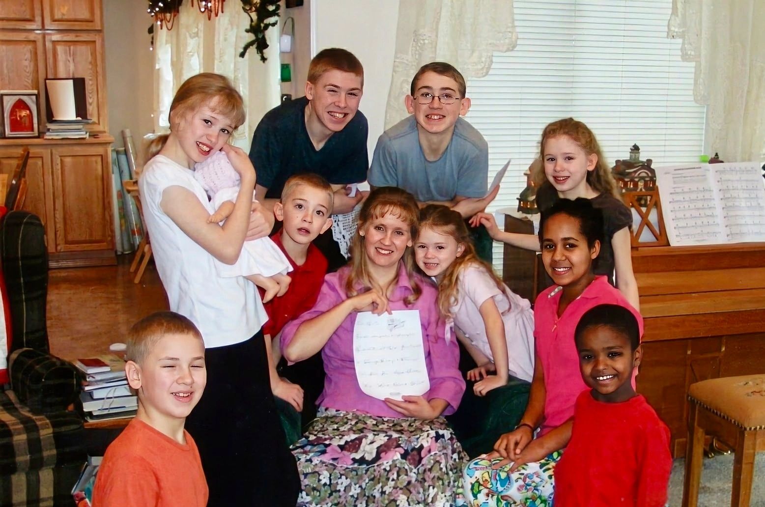 Group photo of a smiling family with children.