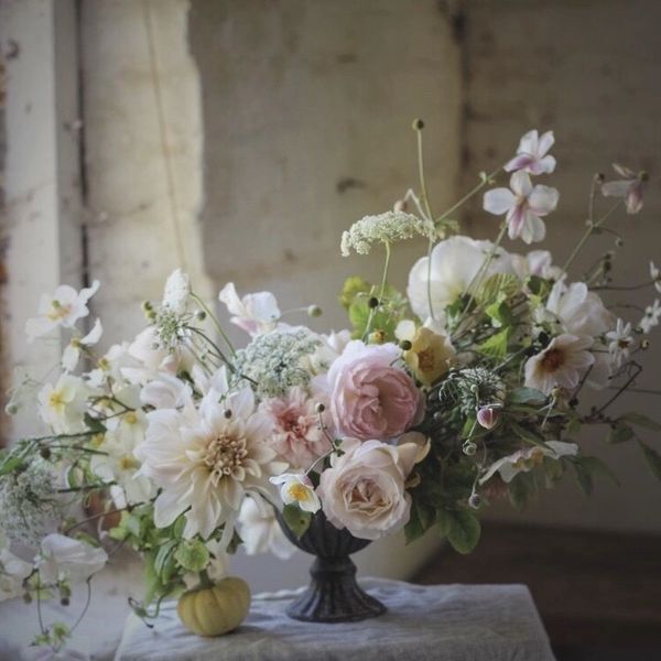 A bouquet of flowers in a vintage vase