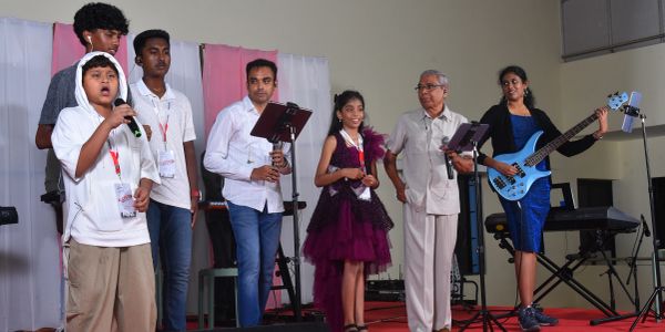 Group of people performing music on stage.