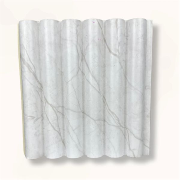 White marble slab with a wave-like corrugated pattern.