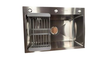 Modern stainless steel kitchen sink with integrated drying rack.