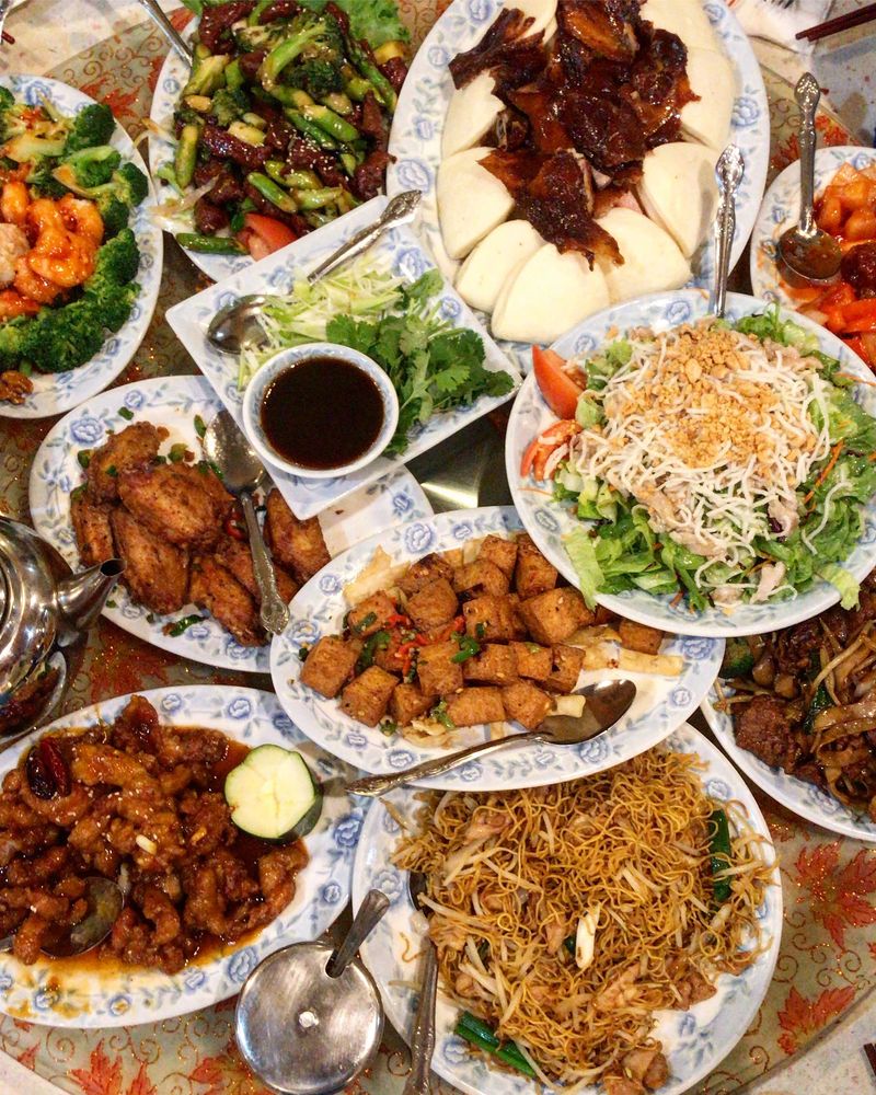 An array of chinese food dishes set out for a meal