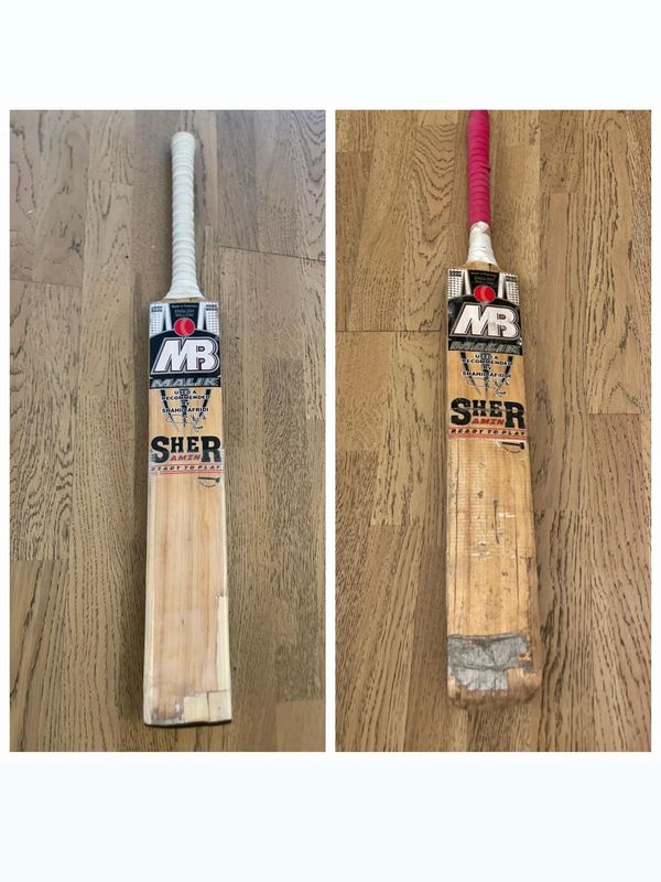 Two MB cricket bats side by side, one new and one worn out.