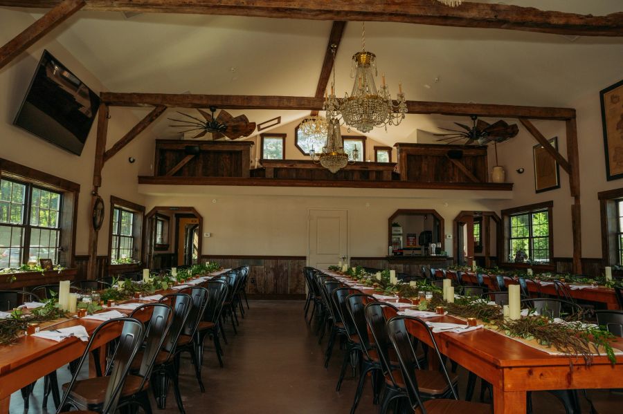 Oscar Barn indoor event space with long wooden tables