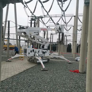 A spider-like utility vehicle working at an electrical substation.