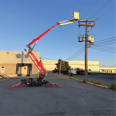 A red cherry picker extends to a utility pole under a clear blue sky.