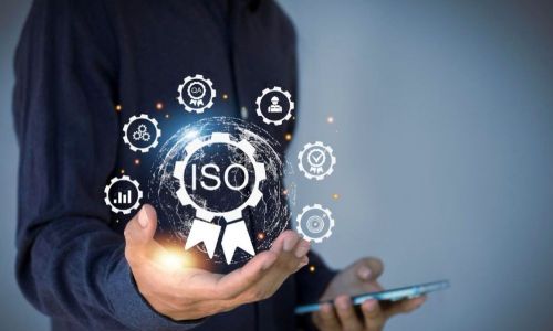 Person holding digital ISO certification icons.