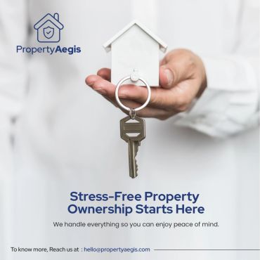 Hand holding a house key with Property Aegis logo.