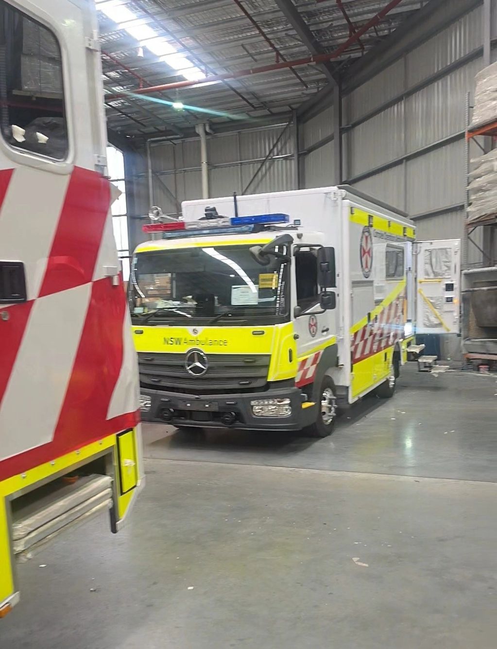 EliteCraft Solutions carrying out hydraulic tail-lift work at the body builder's workshop during an 