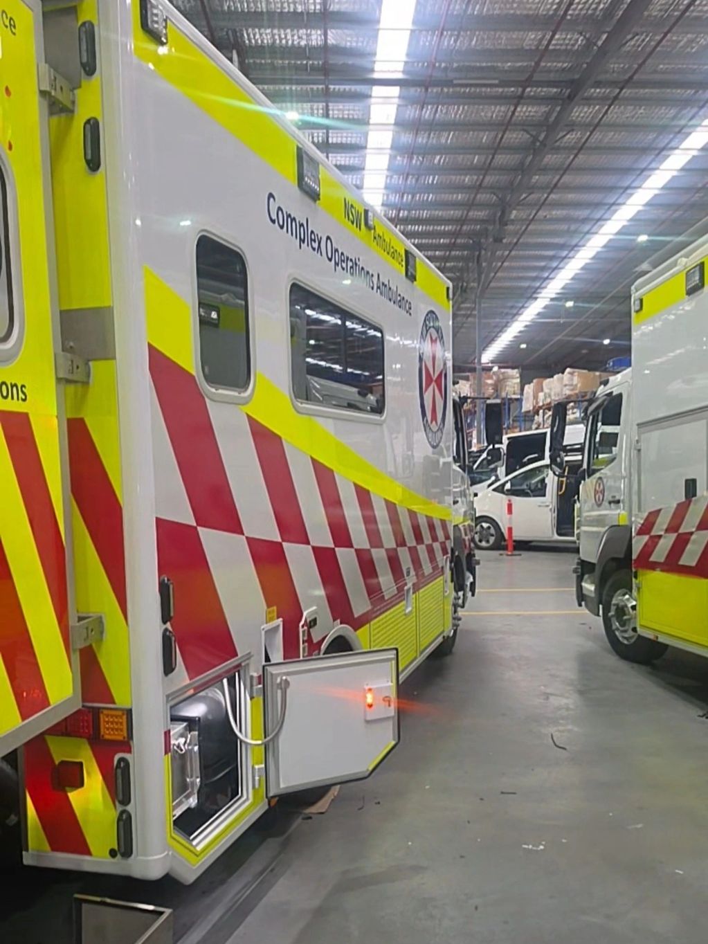 NSW Ambulance Complex Operations vehicle — tail-lift system fitted at the body builder's.