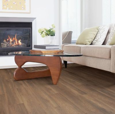 Cozy living room with modern coffee table and fireplace.