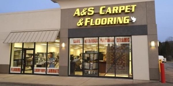 A&amp;S Carpet &amp; Flooring store with illuminated sign and window displays.
