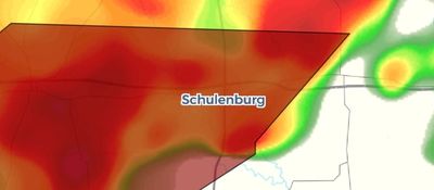 Weather radar showing intense red storm area near Schulenburg.