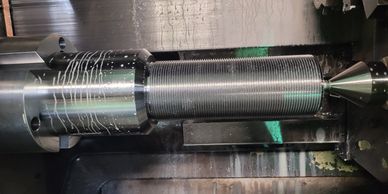 Large left hand bolts turned on our Mori-Seiki Lathe.