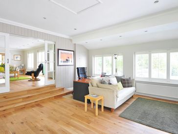 Contemporary furnished, modern living room with vaulted ceiling.