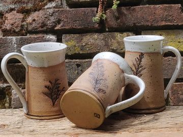 Mugs with cedar imprints