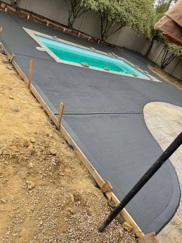 Poolscape, cement pool surround, cement pool patio