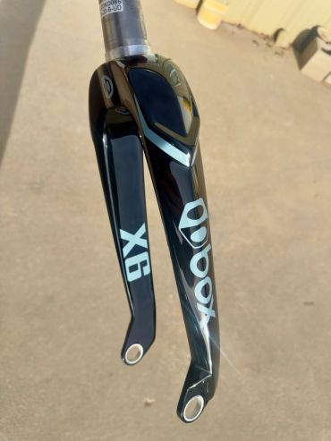 Glossy black Deda X6 bicycle fork with silver branding.