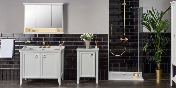 White bathroom furniture in a bathroom with black metro tiles 