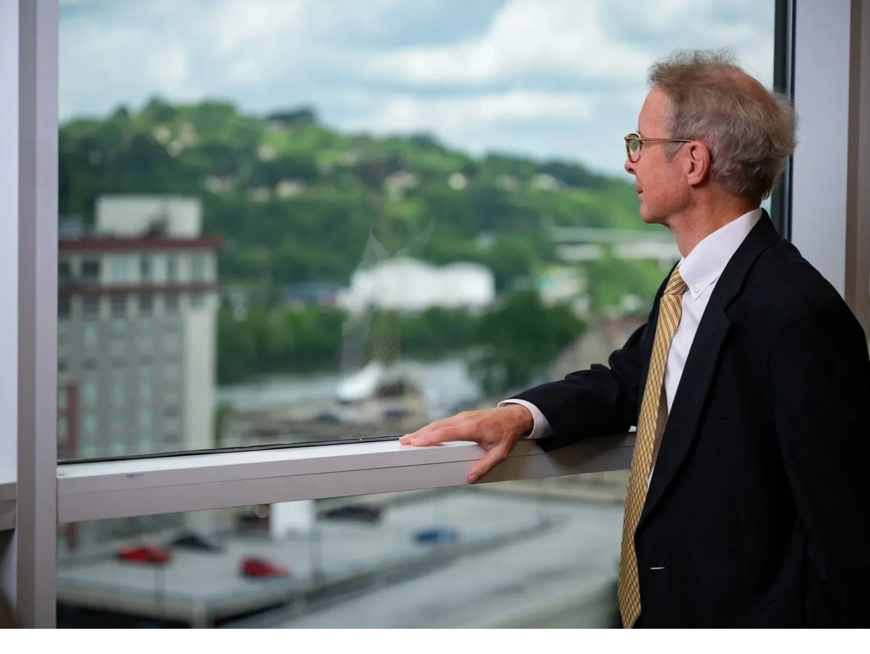 Brooks F. McCabe Jr. looks out over downtown Charleston from the 10th floor conference room. 