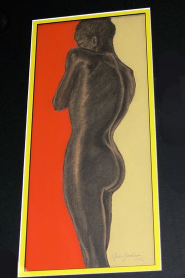 Silhouette of a standing naked man against red and yellow backgrounds.