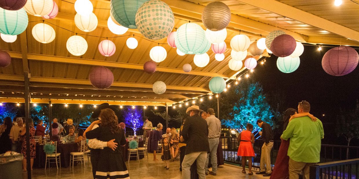 Dancing on the patio at a wedding reception  at Cain's Cove on Lake Nasworthy in San Angelo Texas