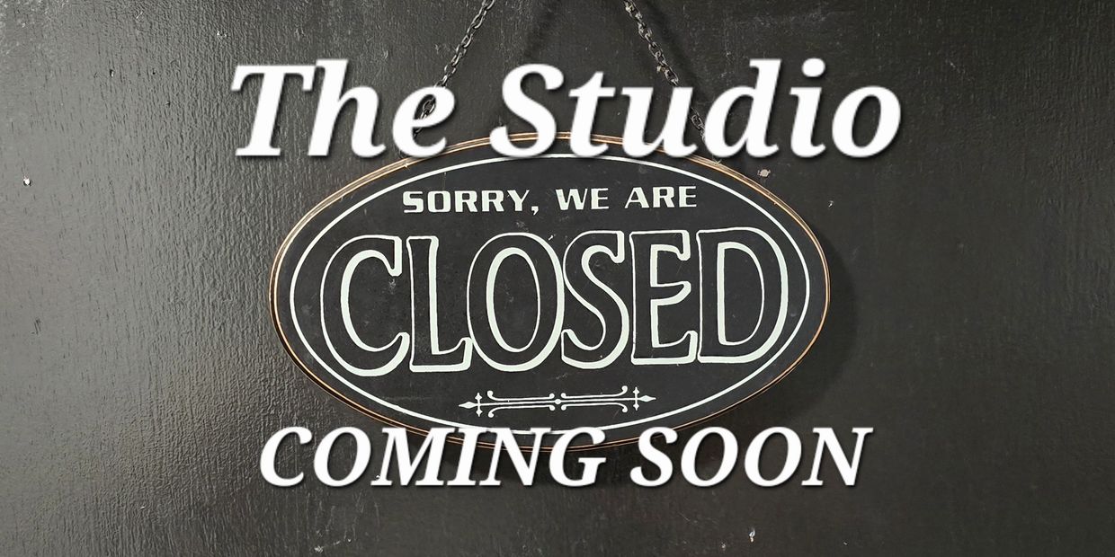 A sign on a black wall reads "The Studio Sorry, We Are Closed Coming Soon."