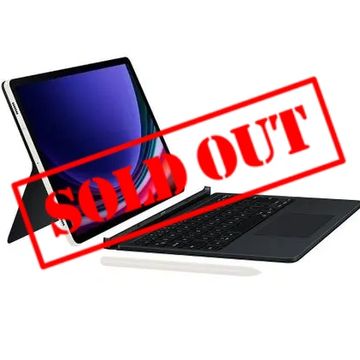 Tablet with detachable keyboard and stylus on white background.