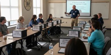 A classroom setting with students attending a private security law course.