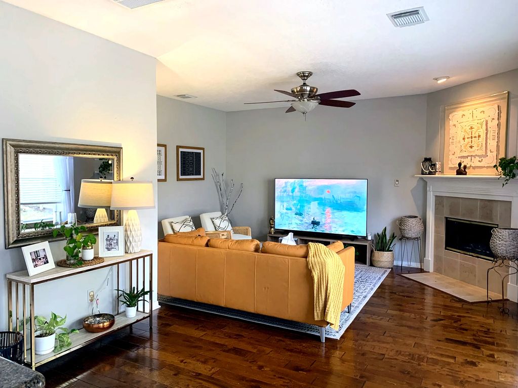 Lighting up the up the wall colors and furniture help reflect light and gave the room a airy feel.