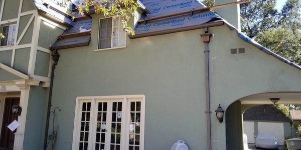 Bondorized steel rain gutter and 3-inch round downspouts with custom leaderheads, Studio City CA