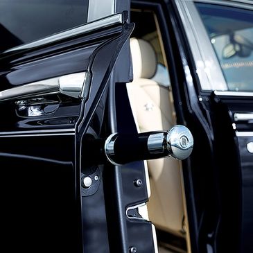 Luxury car door with a unique umbrella holder.