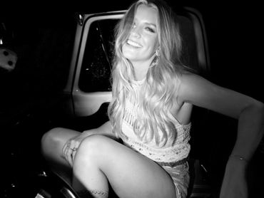 Faith Schueler smiling in car.