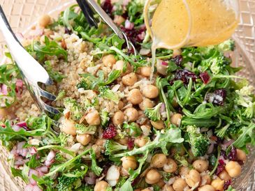 Fresh chickpea and quinoa salad with dressing.