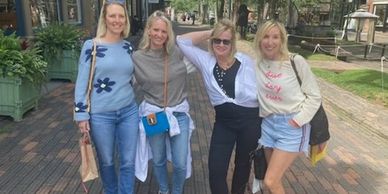  Four women taking a group picture