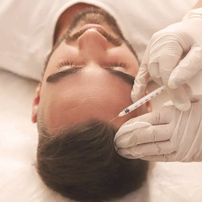 Man getting hair growth injections