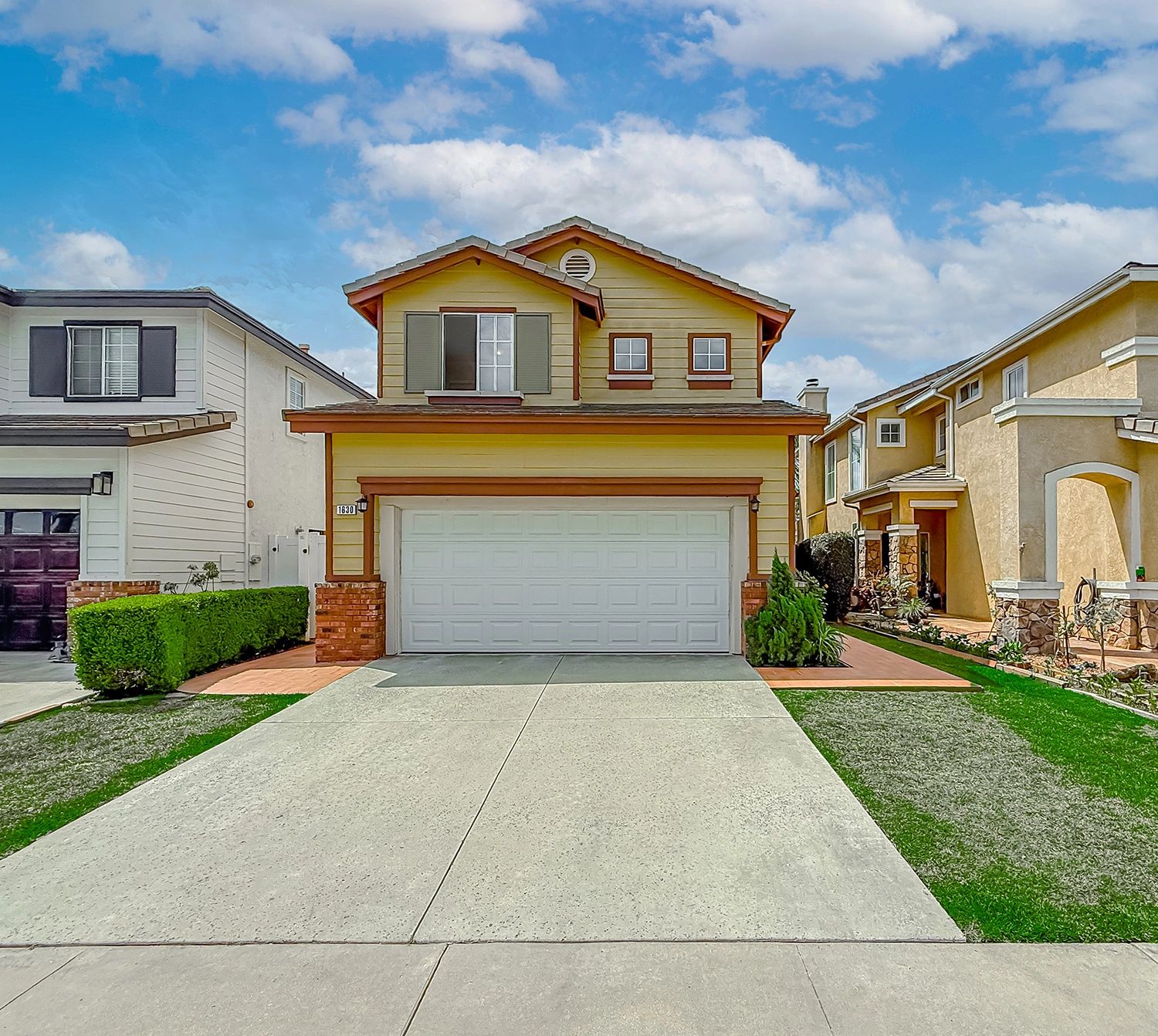 Two-story suburban house with a two-car garage.